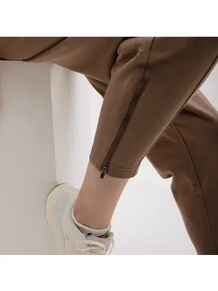Штани New Balance Athletics Pearl, коричневий