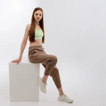 Штани New Balance Athletics Pearl, коричневий