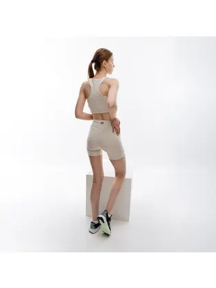 Топ New Balance Essentials Reimagined Bra, бежевий