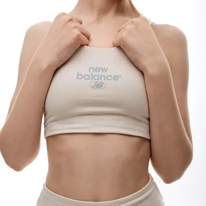 Топ New Balance Essentials Reimagined Bra, бежевий